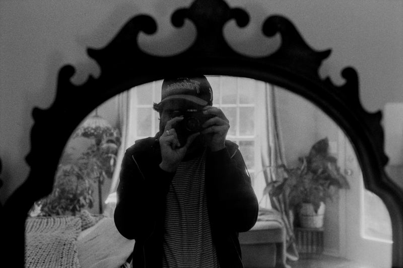 Vanity Self-Portrait — Home (2026). Black and white photograph by Jeff Pearson.